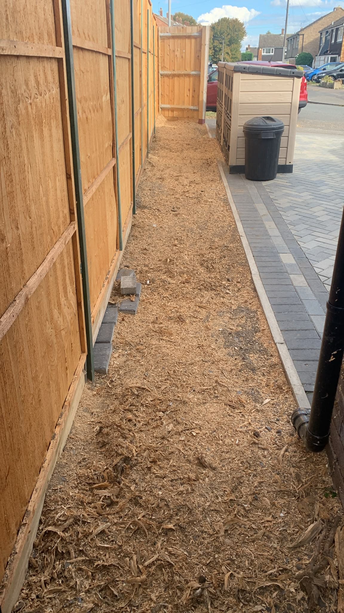 The Hoddesdon side passage fully cleared after grinding, covered in fresh wood chippings with no stumps remaining