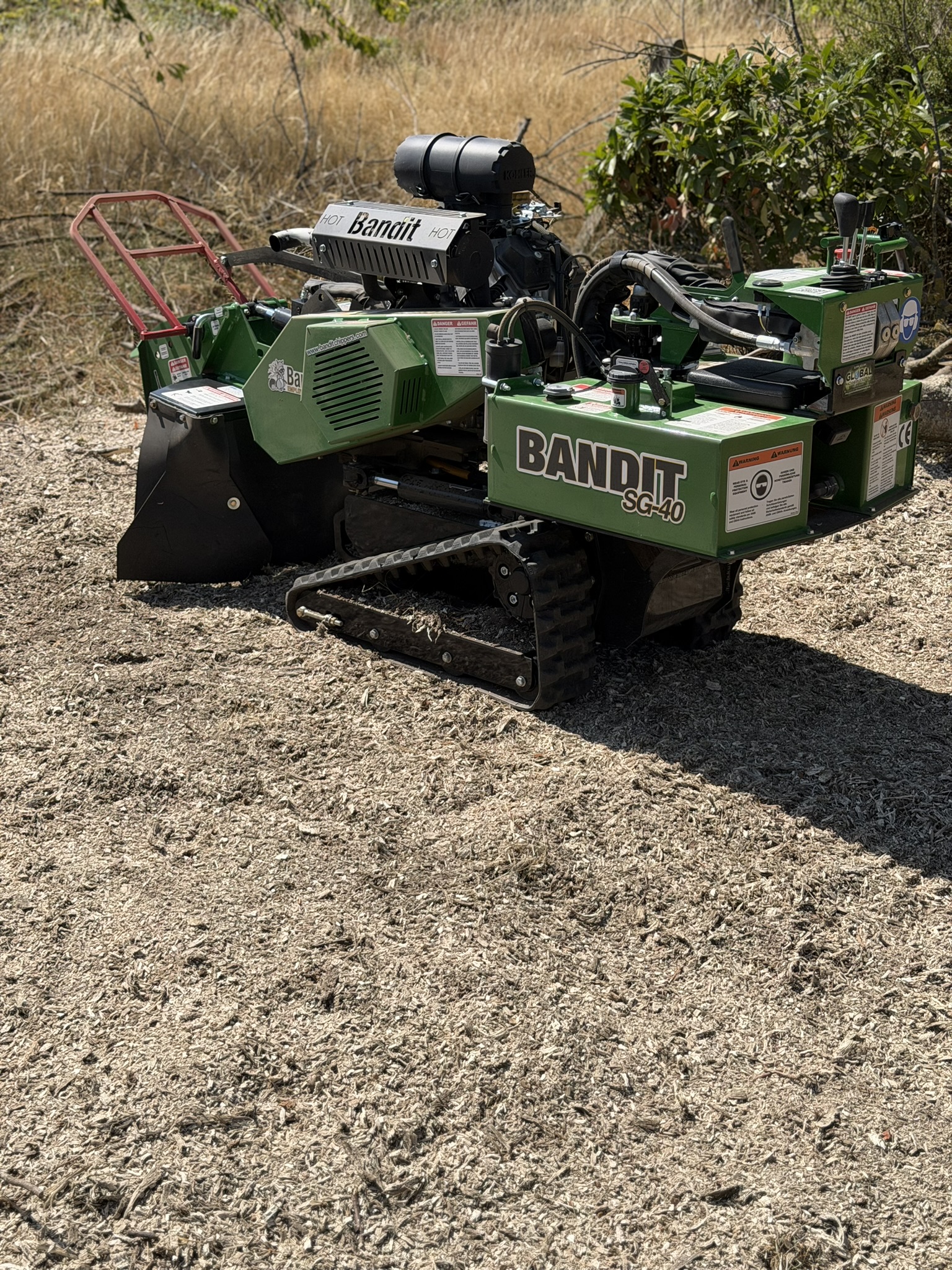 The Bandit SG-40 tracked stump grinder parked on a fresh bed of wood chippings on the Chelmsford site
