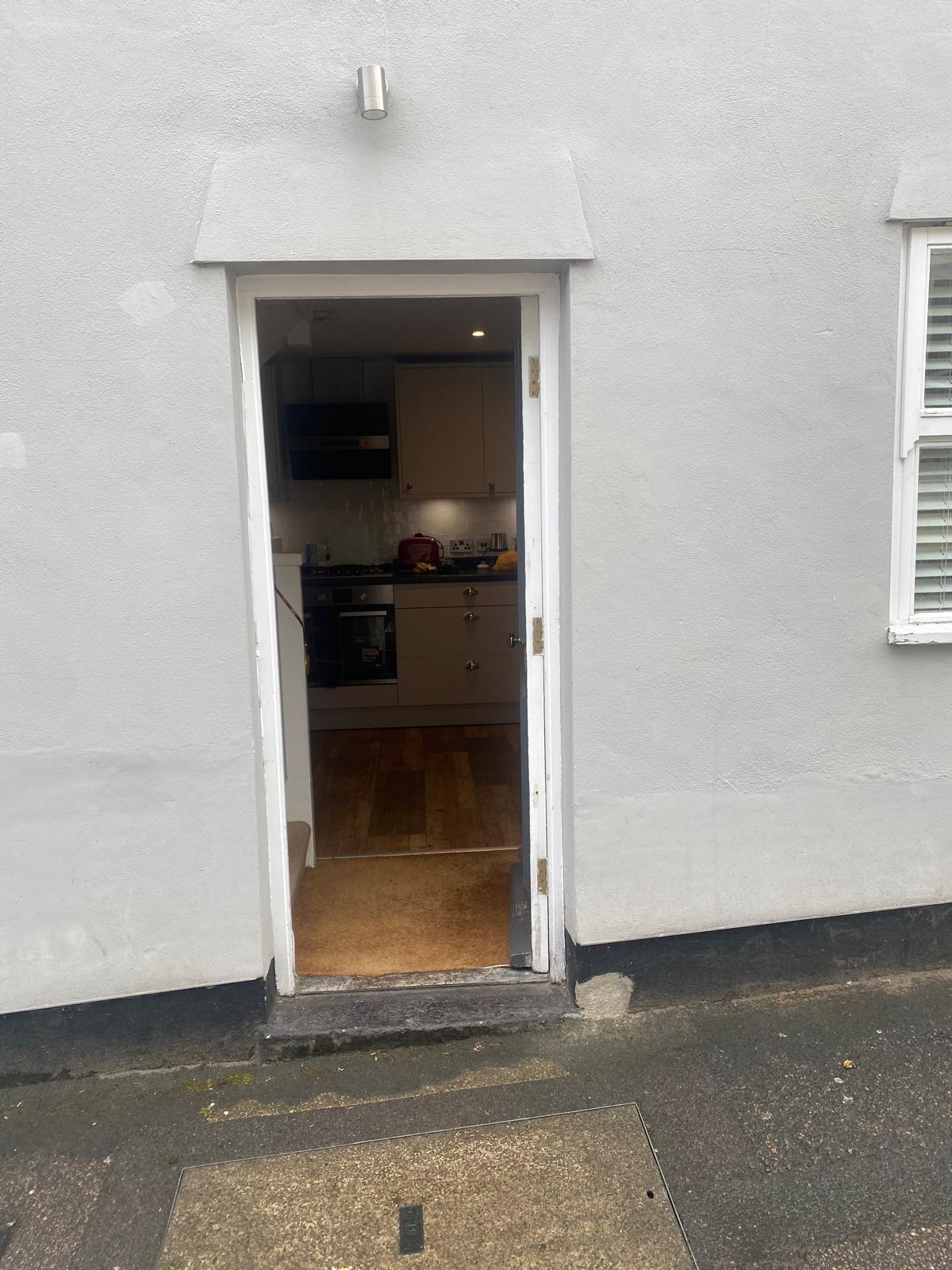 Narrow exterior doorway the stump grinder was manoeuvred through to reach the garden